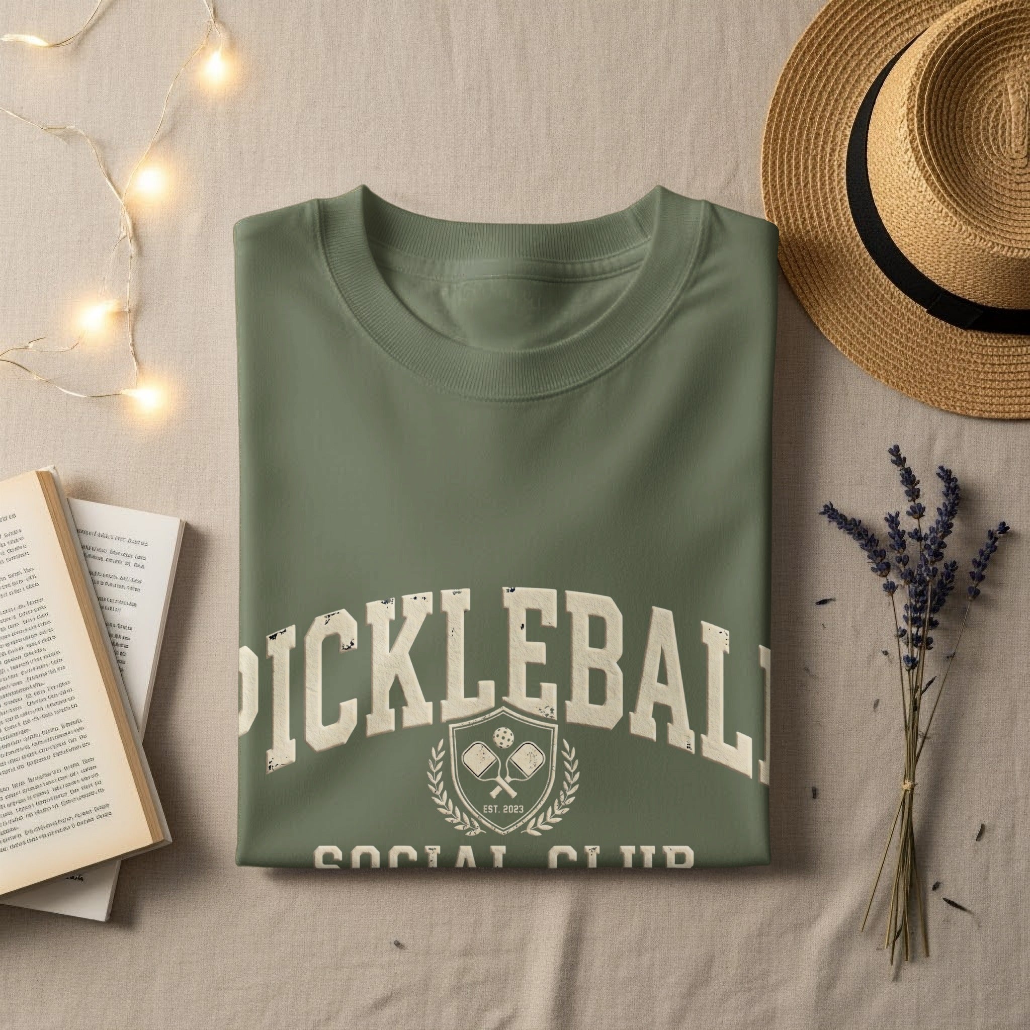 Olive green t-shirt with "Pickleball Social Club Est. 2023" and crest graphic.
