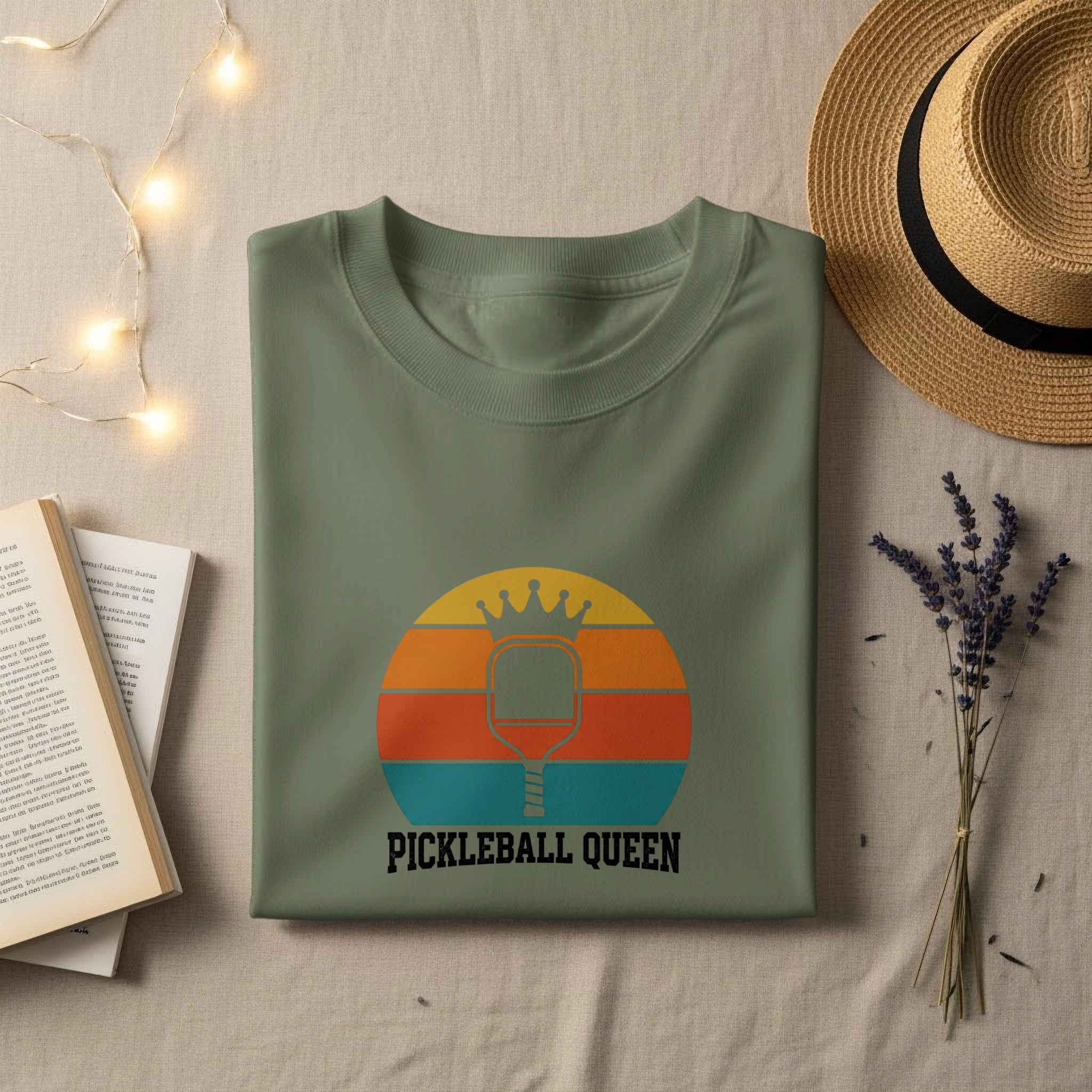 Green t-shirt with "PICKLEBALL QUEEN" text and a pickleball paddle graphic.