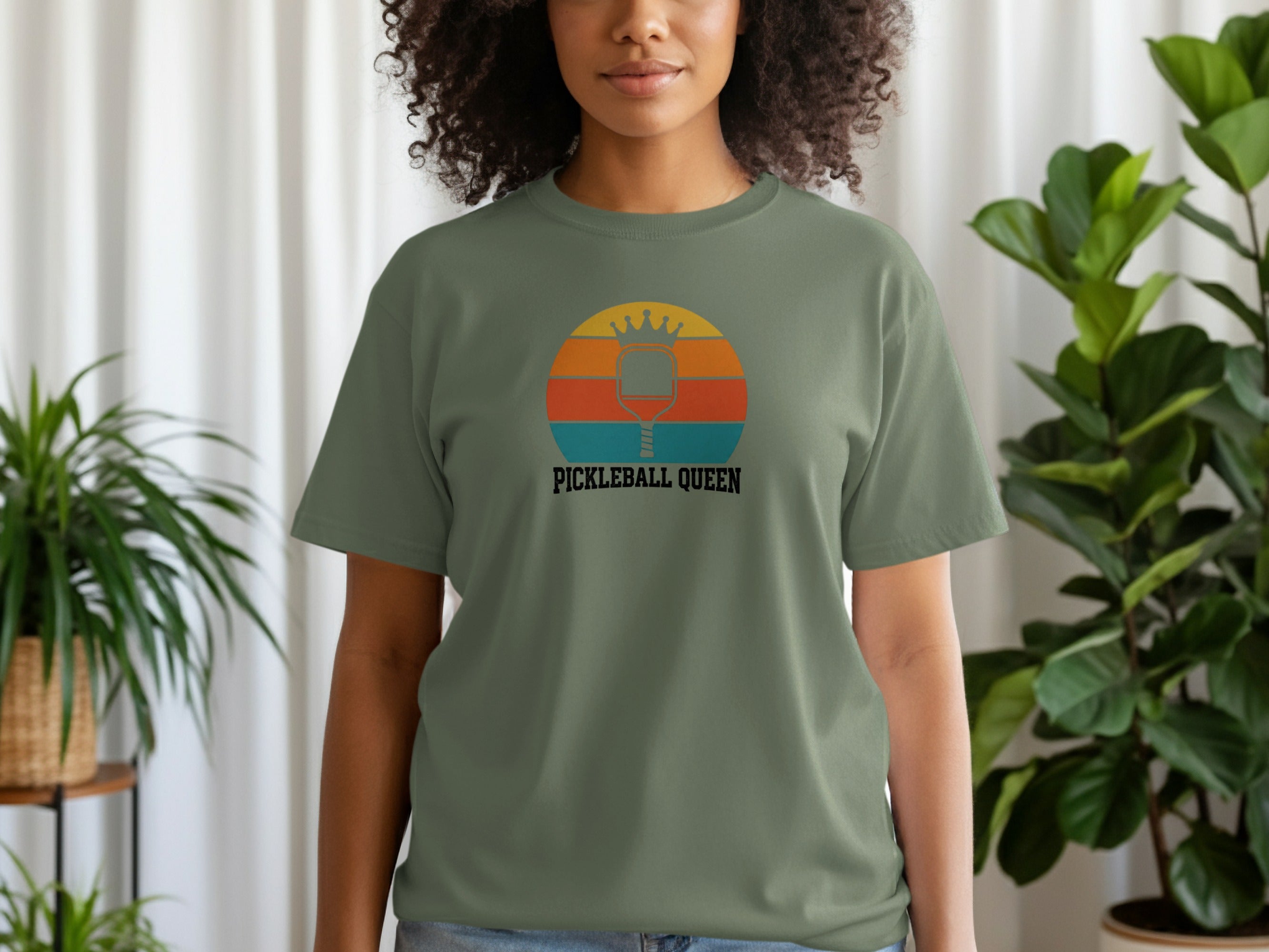 Green t-shirt with "Pickleball Queen" text and a sunset graphic.