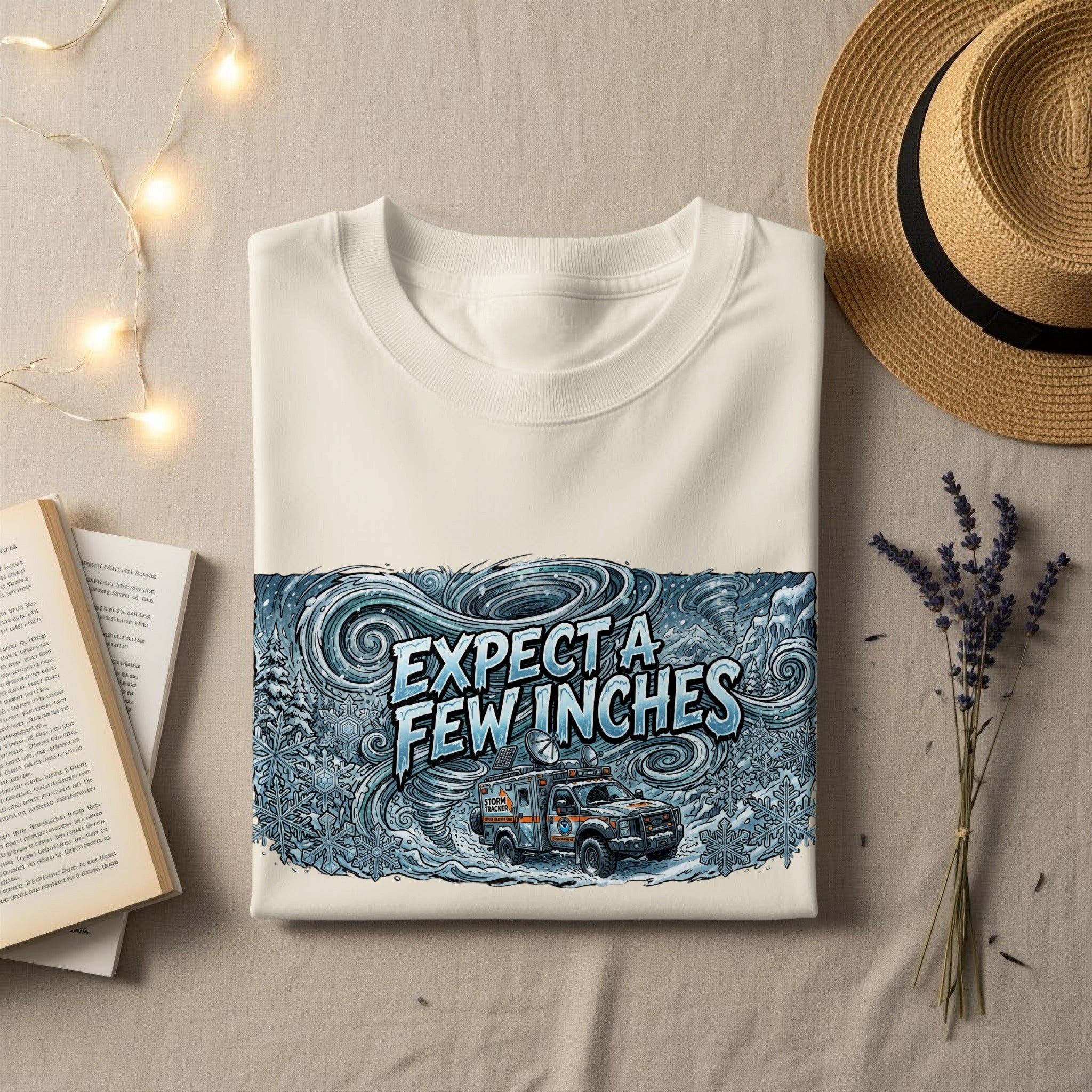 Cream sweatshirt with "EXPECT A FEW INCHES" and storm tracker graphic.