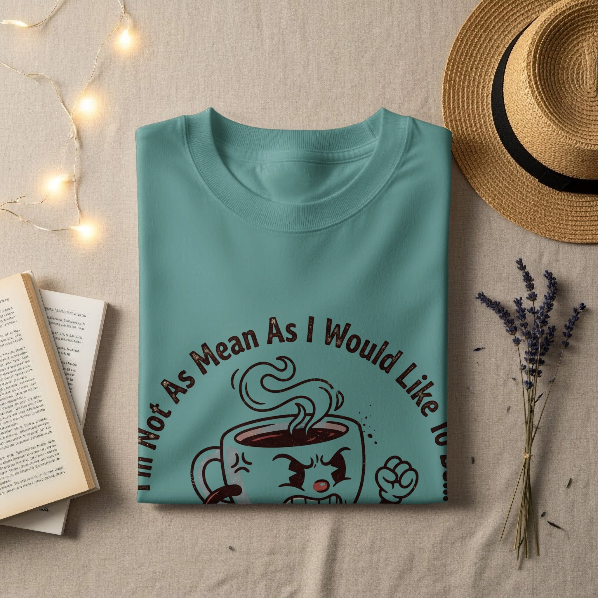 Teal t-shirt with "Not As Mean As I Would Like To" text and cartoon coffee cup.