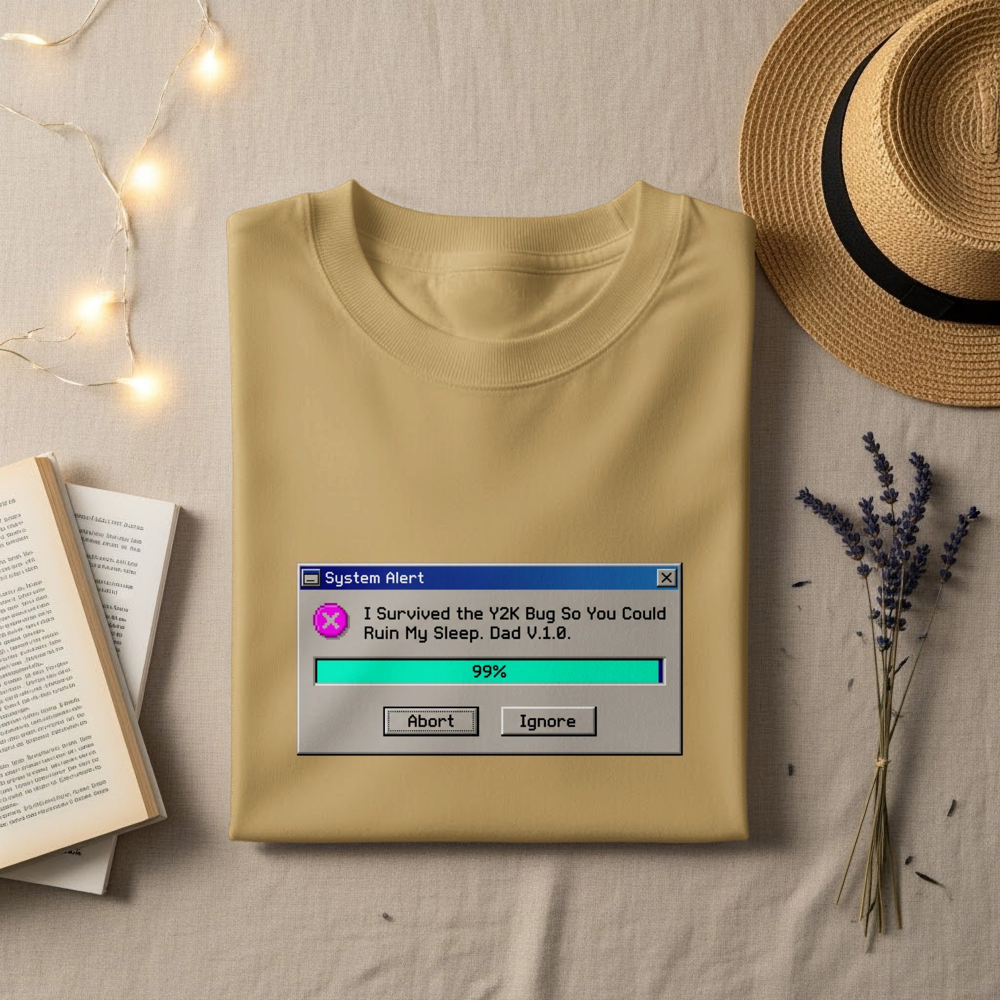 T-shirt with "System Alert: I Survived the Y2K Bug So You Could Ruin My Sleep. Dad V.1.0." text.