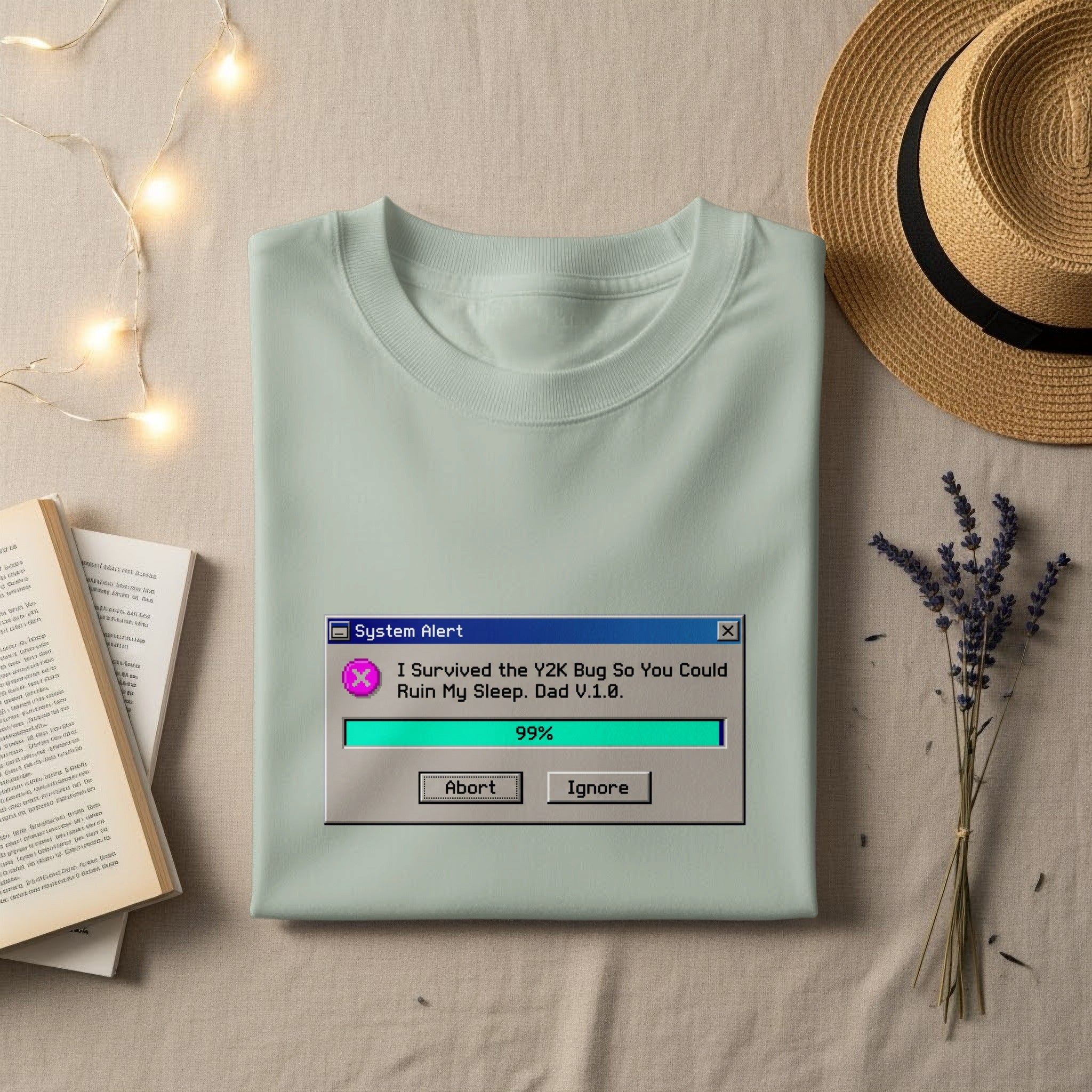 T-shirt with "System Alert" pop-up: "I Survived the Y2K Bug So You Could Ruin My Sleep. Dad V.1.0."