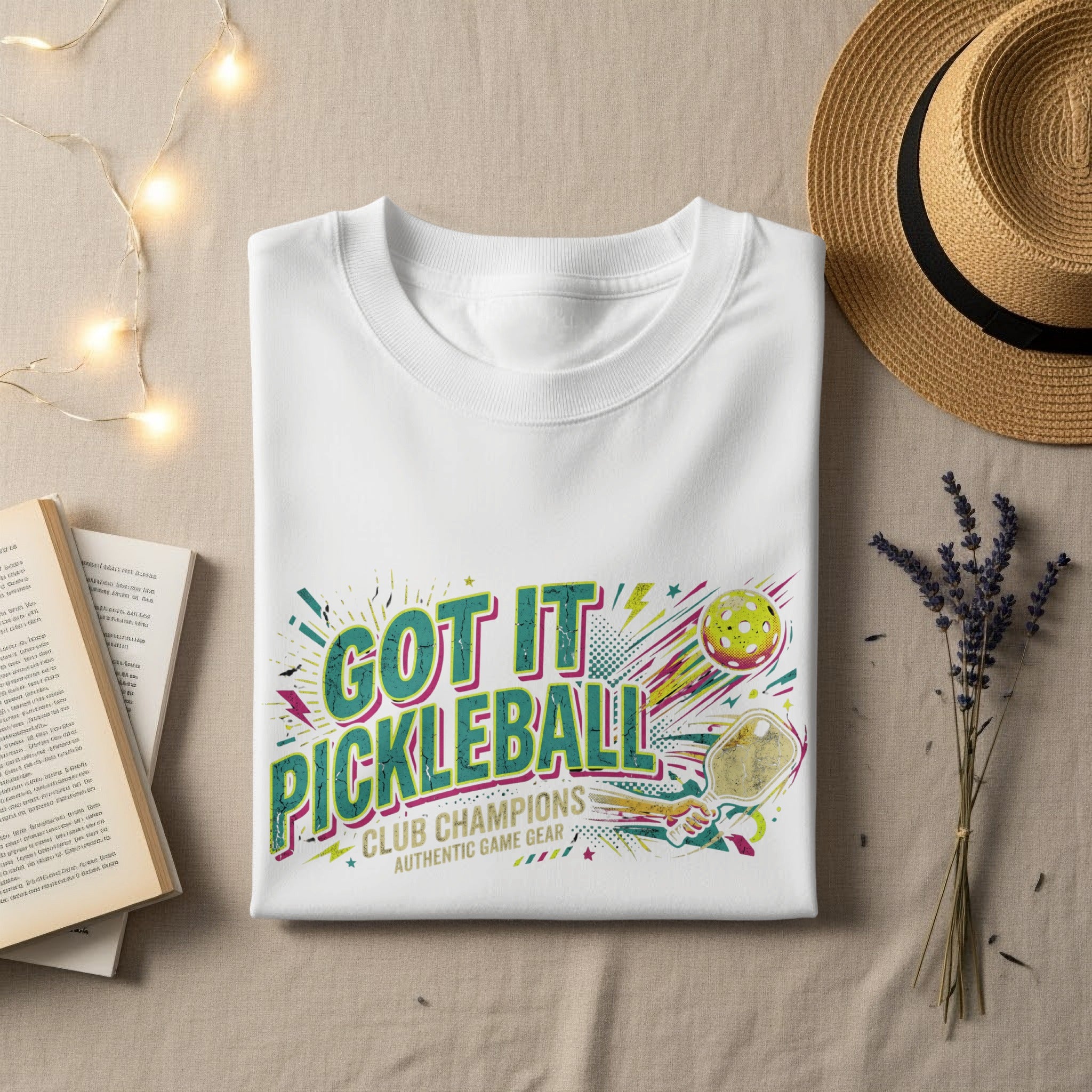 White t-shirt with "Got It Pickleball Club Champions" text and graphics.