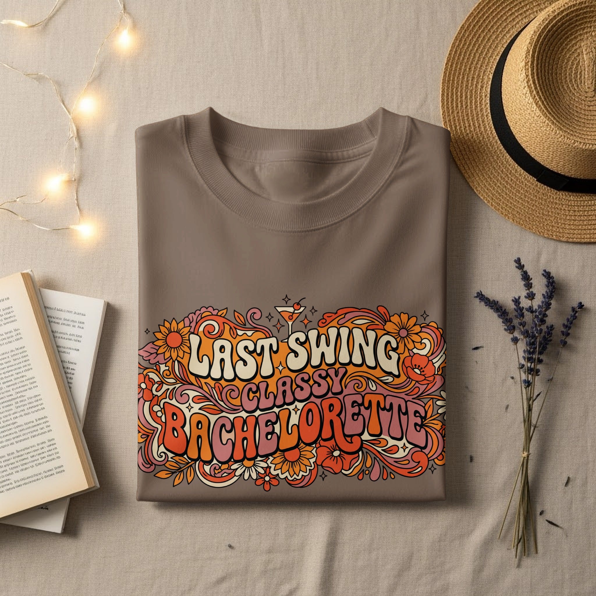 Brown t-shirt with "Last Swing Classy Bachelorette" in floral lettering.