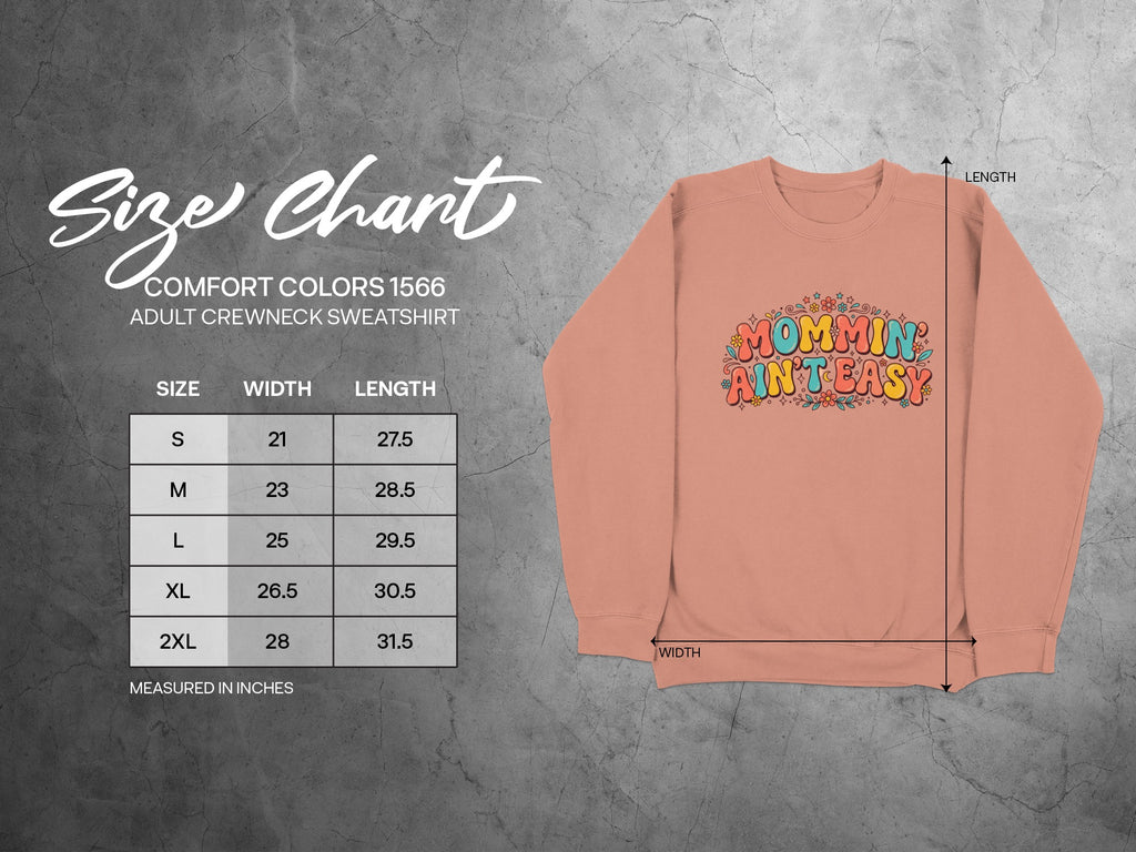 Comfort Colors 1566 adult crewneck sweatshirt size chart with "Mommin Ain't Easy" graphic.