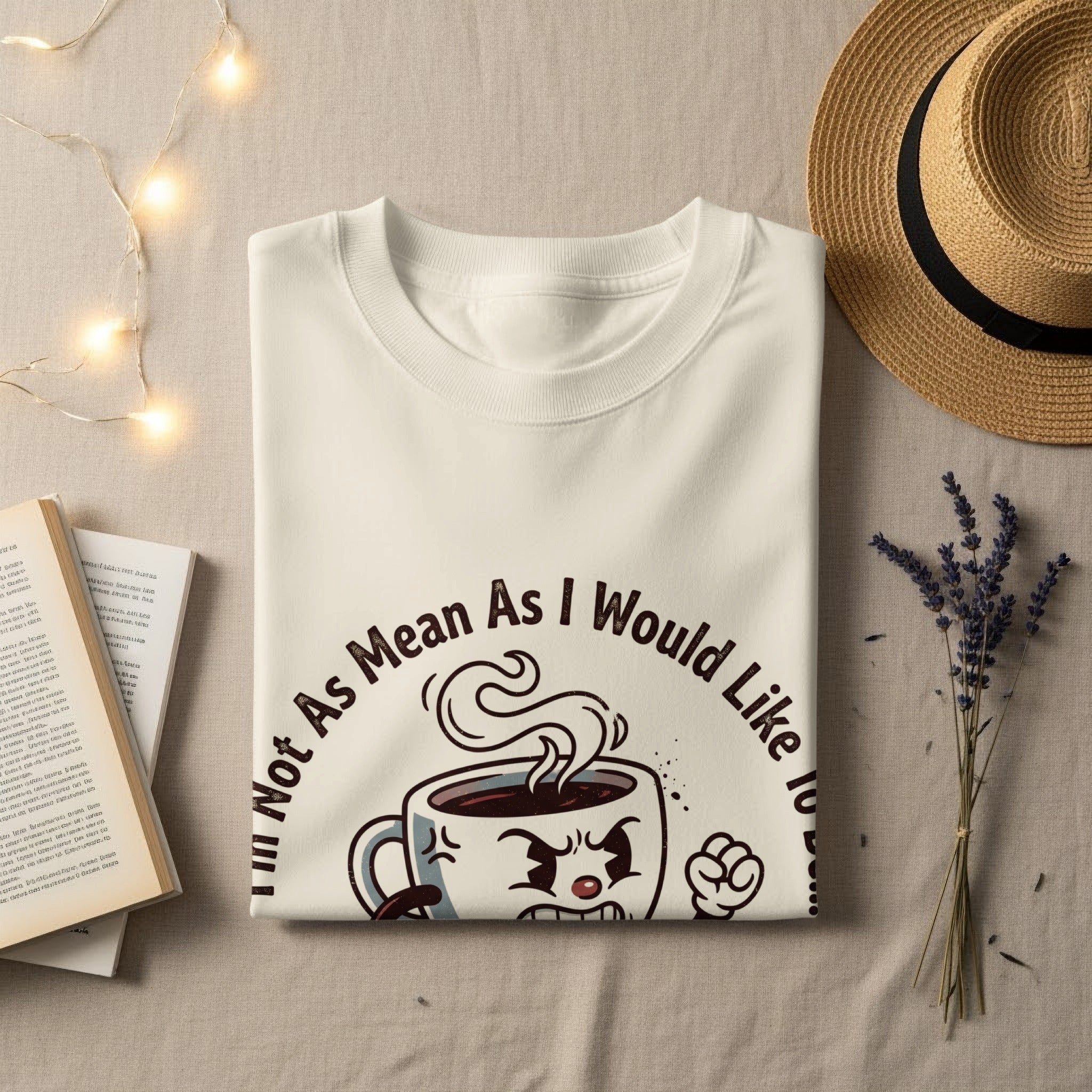 White t-shirt with cartoon coffee cup saying "Not As Mean As I Would Like To Be".