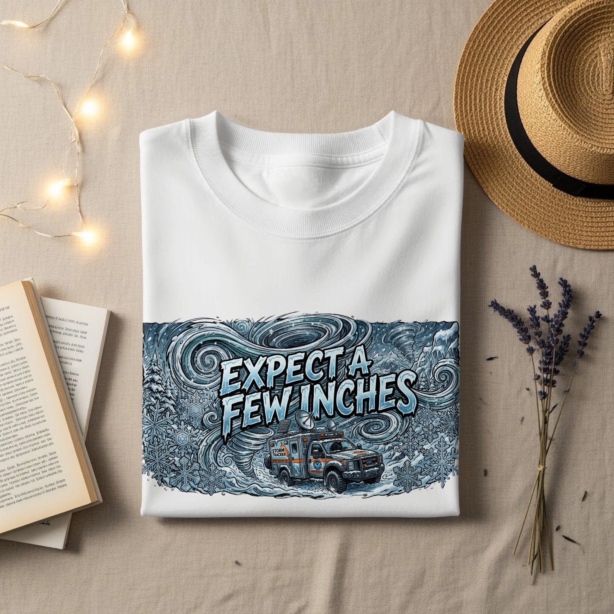 White sweatshirt with "Expect a Few Inches" and "Storm Tracker" graphic.