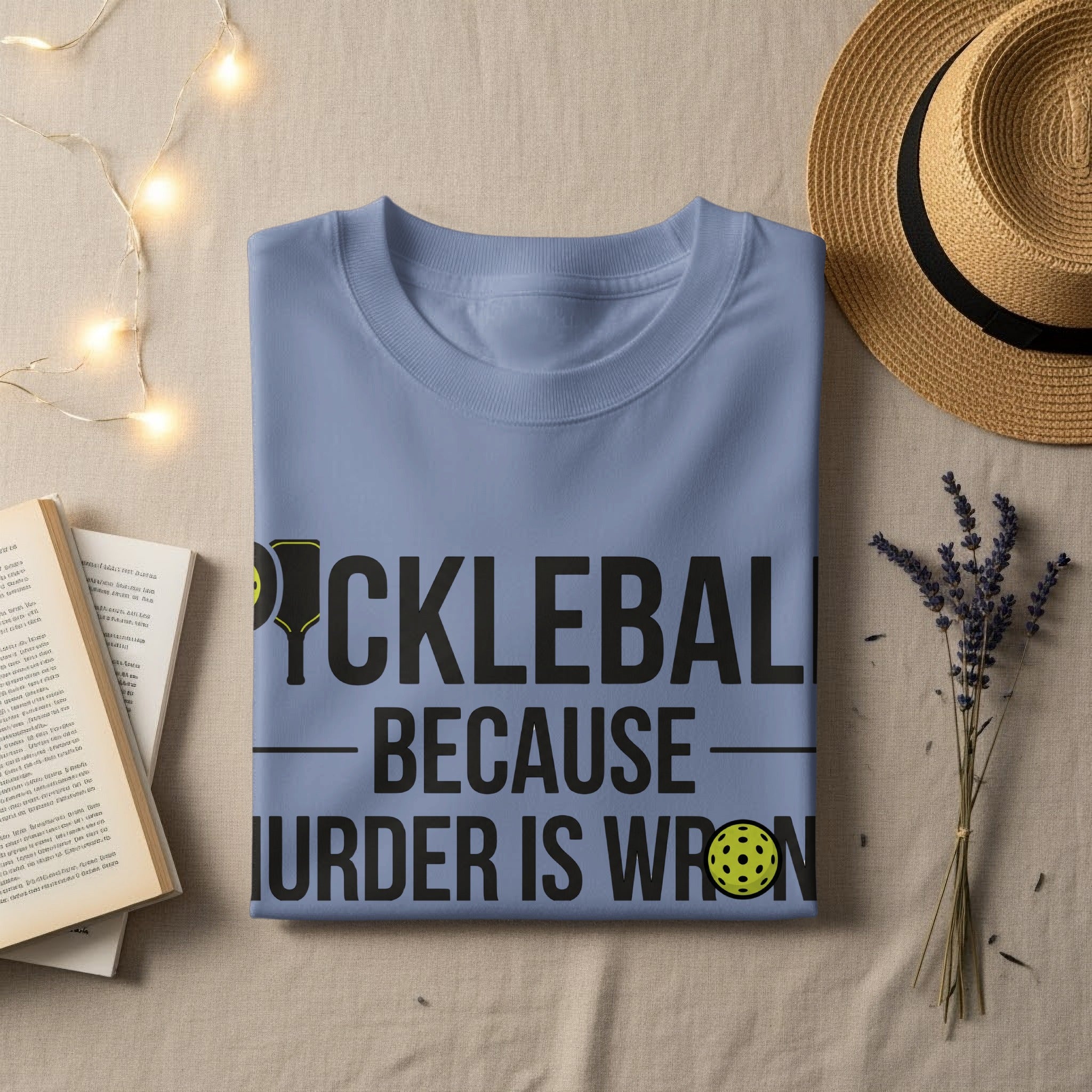 Light blue t-shirt with "PICKLEBALL BECAUSE MURDER IS WRONG" text.