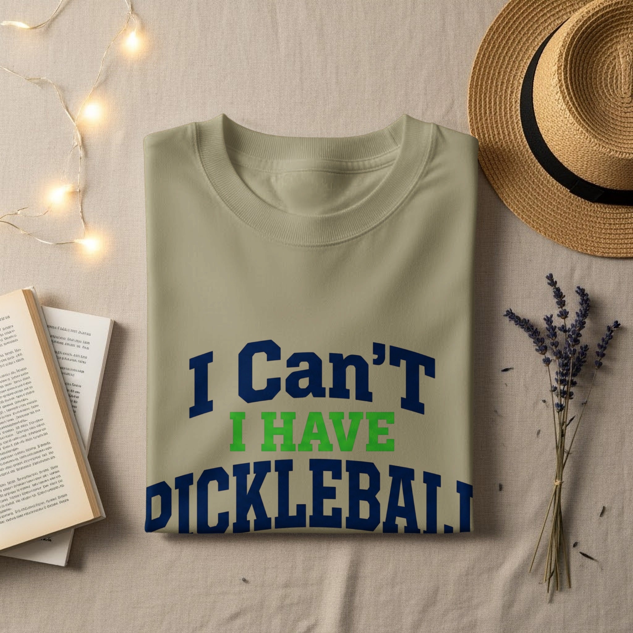 Tan t-shirt with "I Can't I HAVE PICKLEBALL" text.