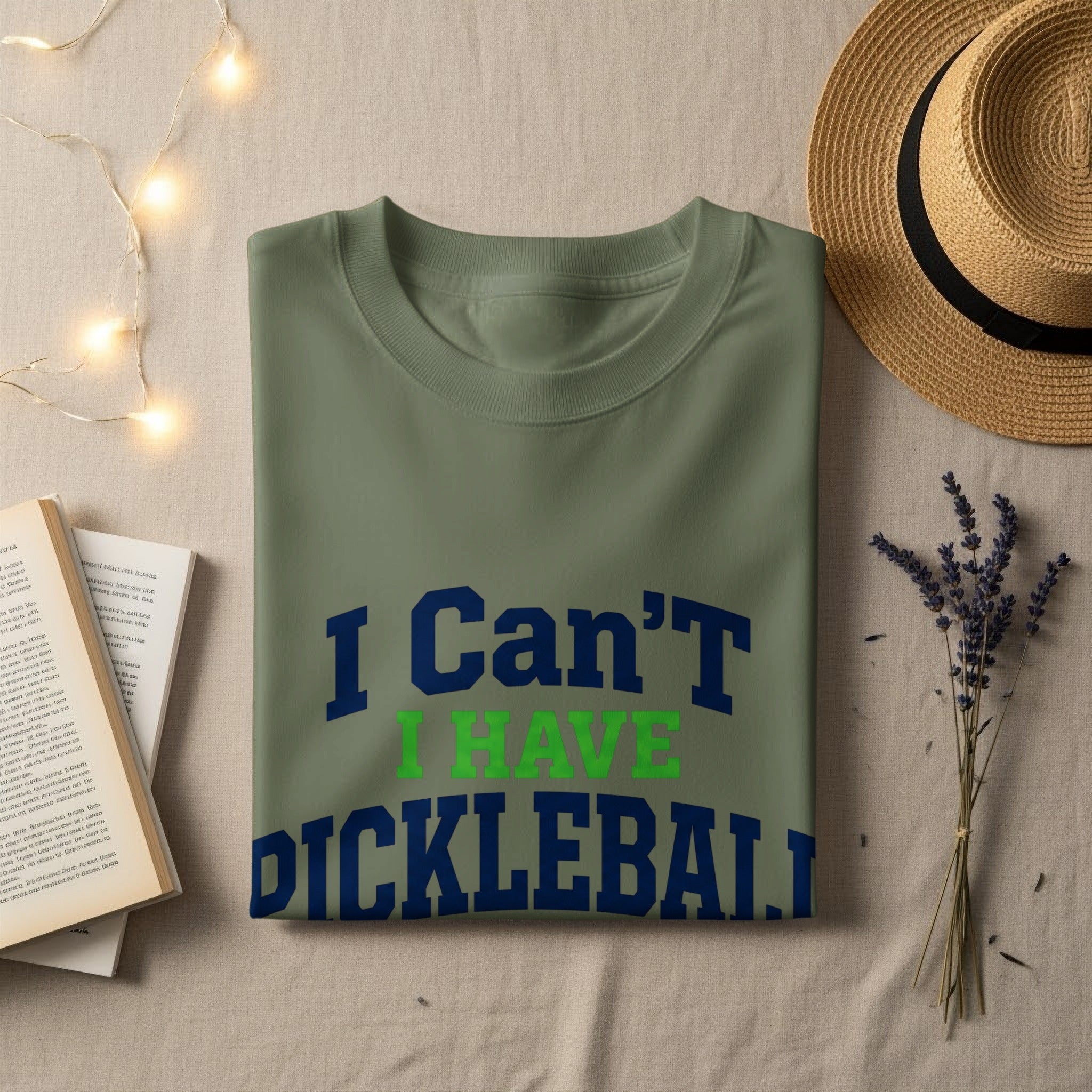 Green t-shirt with navy and green text "I Can't I Have Pickleball".