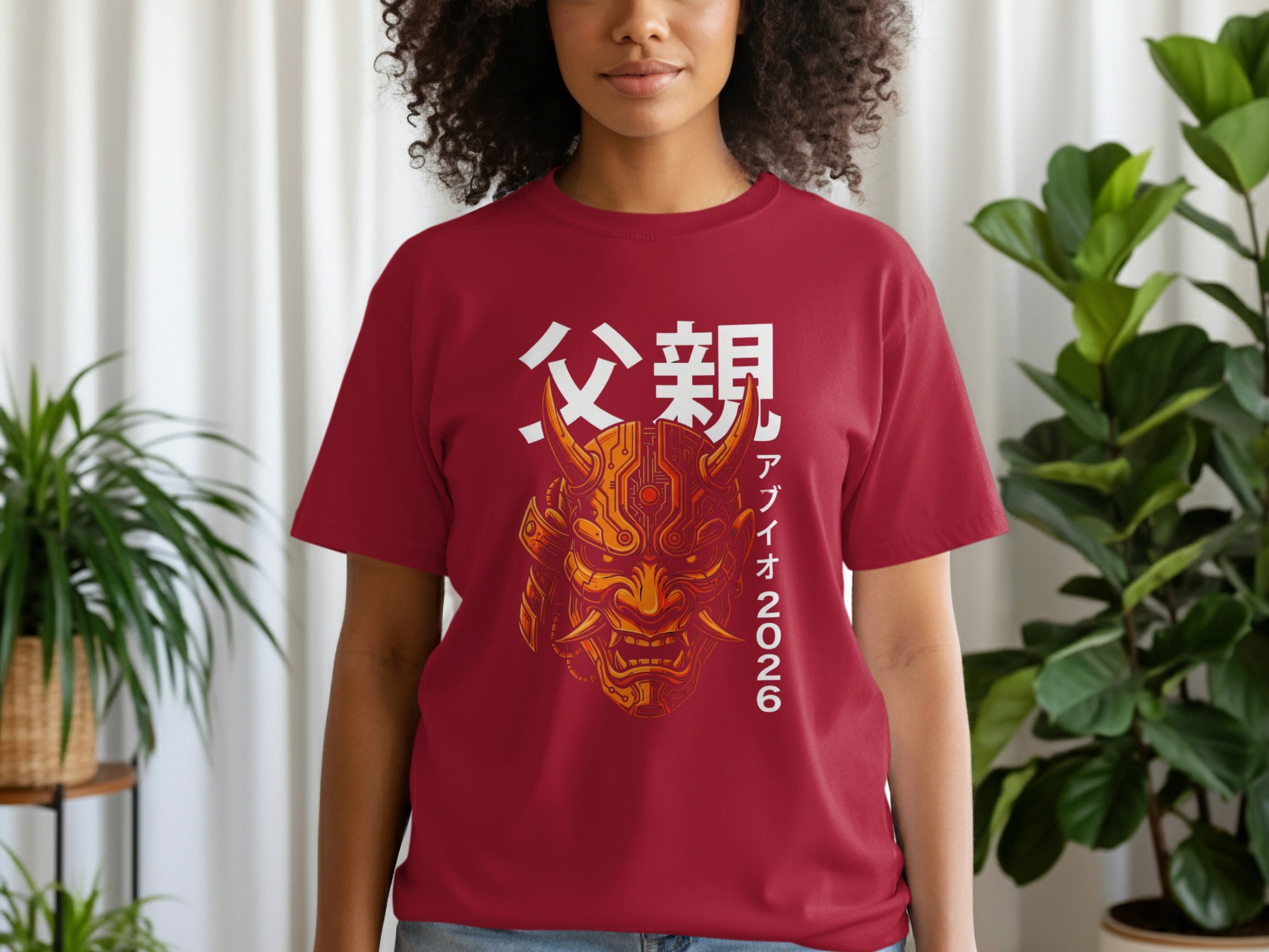 Red t-shirt with Japanese characters and a golden demon mask design.