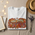 White sweatshirt with "Last Swing Bachelorette" text and floral design.