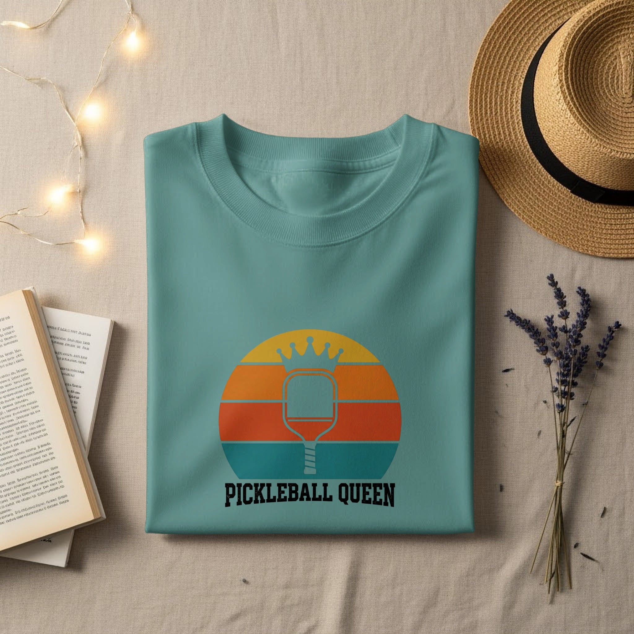 Teal t-shirt with "PICKLEBALL QUEEN" and a graphic of a pickleball paddle and ball.